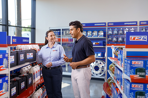 two people looking at batteries