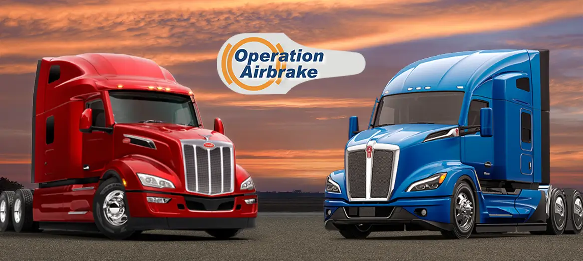 “A Kenworth truck and a Peterbilt truck promoting CVSA Operation AirbrakeWeek